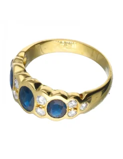 Anillo de oro 18 kl con diamantes y zafiros