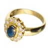 Anillo de oro 18 kl con diamantes y zafiro