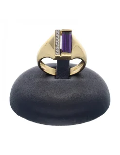 Anillo de oro amarillo 18 K con diseño circonitas y piedra sintética