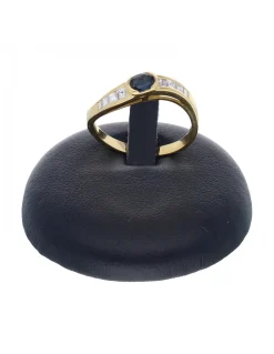 Anillo de oro amarillo 18 K con diseño brillantes y zafiro
