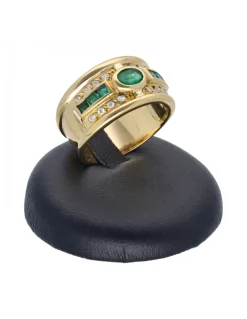 Anillo de oro amarillo 18 Kl con diseño y zircones y piedras sintéticas
