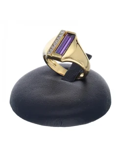 Anillo de oro amarillo 18 K con diseño circonitas y piedra sintética