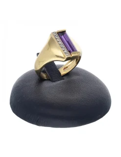 Anillo de oro amarillo 18 K con diseño circonitas y piedra sintética