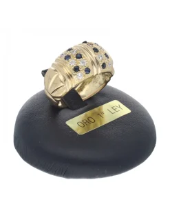 Anillo de oro amarillo con diseño y circonitas