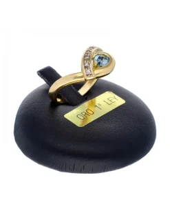 Anillo de oro amarillo 18K con diseño y zircón azul