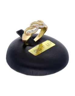 Anillo de oro amarillo 18K con diseño y circonitas