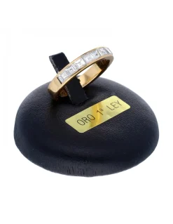 Anillo de oro amarillo 18K con diseño y brillantes