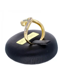 Anillo de oro amarillo 18K con diseño y zircón azul