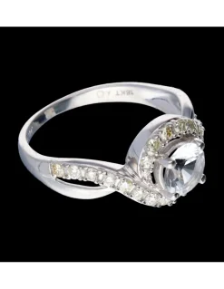 Anillo de oro blanco 18 kl con zirconita central y diamantes