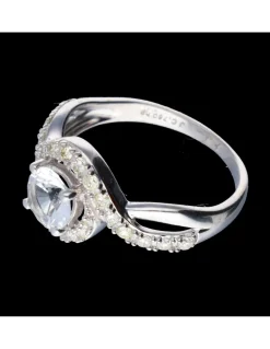 Anillo de oro blanco 18 kl con zirconita central y diamantes