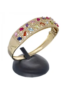 Brazalete rígido de oro amarillo 18 Kl con diseño y zirconitas de colores