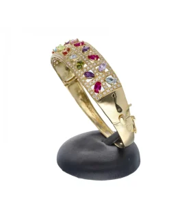 Brazalete rígido de oro amarillo 18 Kl con diseño y zirconitas de colores