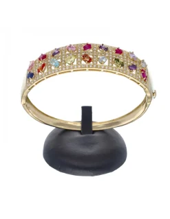Brazalete rígido de oro amarillo 18 Kl con diseño y zirconitas de colores
