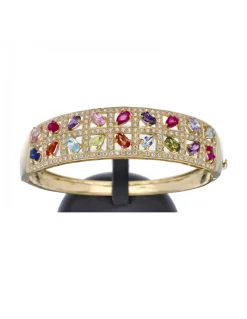 Brazalete rígido de oro amarillo 18 Kl con diseño y zirconitas de colores