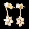 Pendientes diseño flor con zirconitas oro amarillo 18kl