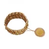 Pulsera ancha de Oro amarillo con diseño original y moneda antigua