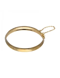 Pulsera de Oro amarillo con diseño rígido y detalles labrados