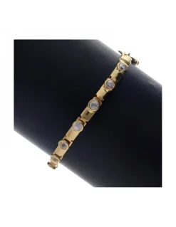 Pulsera de oro amarillo 18K con diseño y circonitas