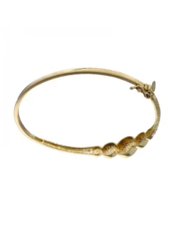 Pulsera de oro amarillo 18K con diseño rígido y circonitas