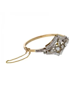 Pulsera de oro amarillo y blanco 18K con diseño y brillantes
