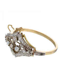 Pulsera de oro amarillo y blanco 18K con diseño y brillantes