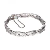 Pulsera de Oro blanco con diseño semirrígido y Brillantes