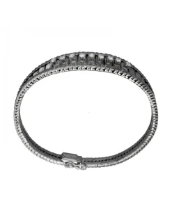 Pulsera de Oro blanco con diseño semirrígido y nueve Brillantes